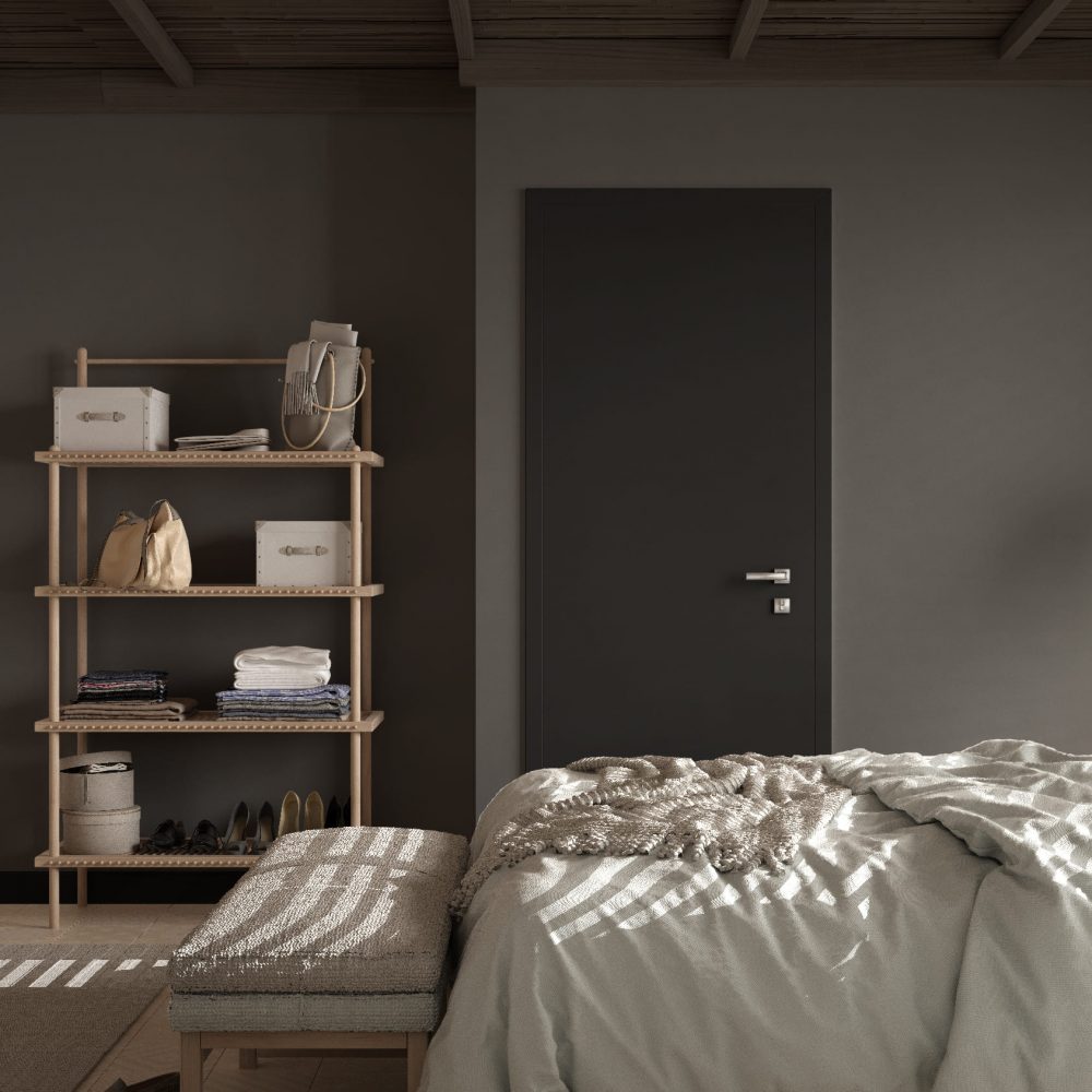 Habitación pared gris con cama y puerta oscura